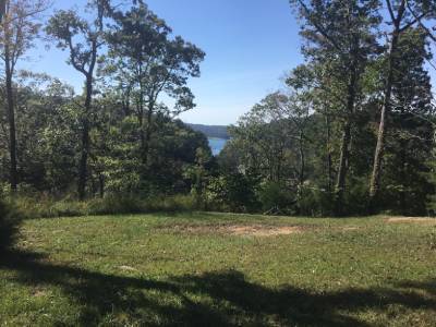 Wooded lake view at Kumberland Campground
