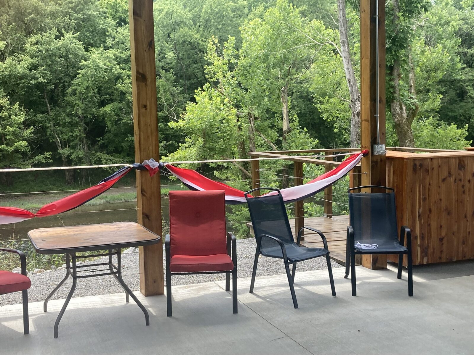 Riverside pavilion with hammocks at Paddle Trail Campground